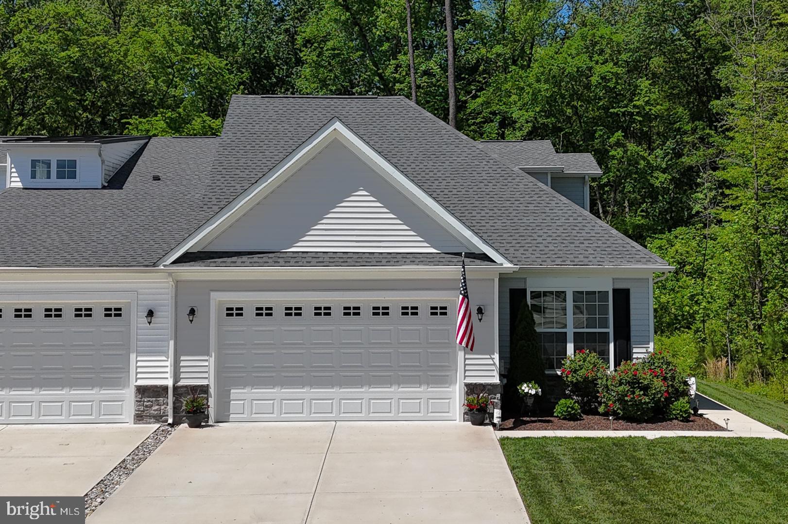 314 Tranquility Way Middletown, DE 19709 - Photo 2 of 56 a house with a yard plants and large tree