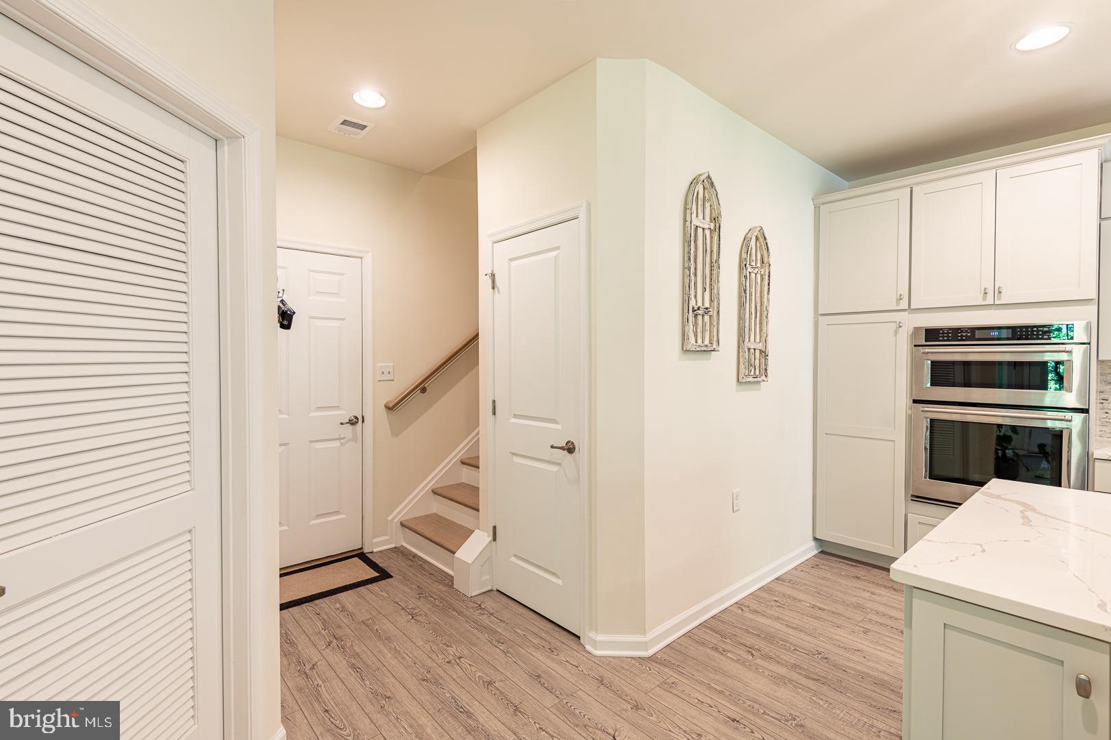 314 Tranquility Way Middletown, DE 19709 - Photo 28 of 56 a view of a kitchen with wooden floor and electronic appliances