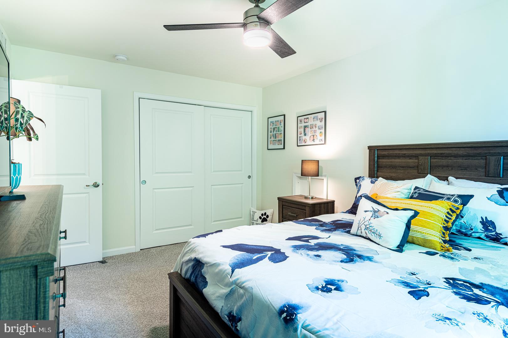 314 Tranquility Way Middletown, DE 19709 - Photo 39 of 56 a bedroom with a bed and a table