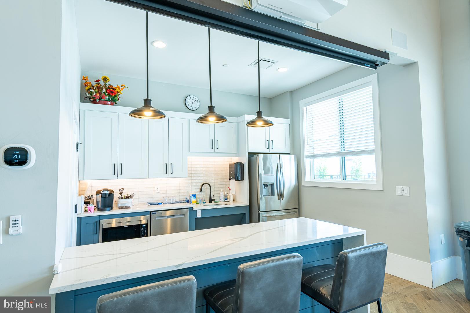 314 Tranquility Way Middletown, DE 19709 - Photo 49 of 56 a kitchen with kitchen island cabinets and island