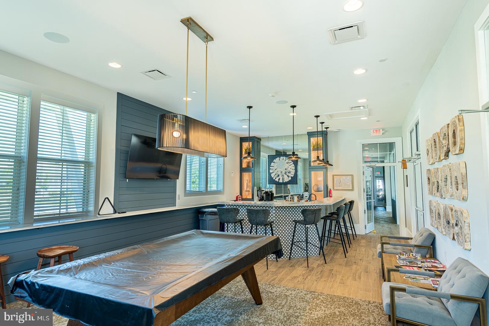 314 Tranquility Way Middletown, DE 19709 - Photo 53 of 56 a room with stainless steel appliances kitchen island a table chairs in it and wooden floors