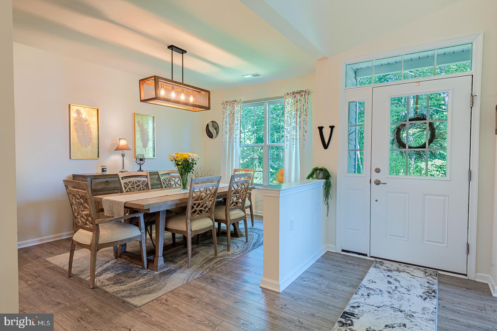 314 Tranquility Way Middletown, DE 19709 - Photo 5 of 56 a view of a dining room with furniture window and wooden floor