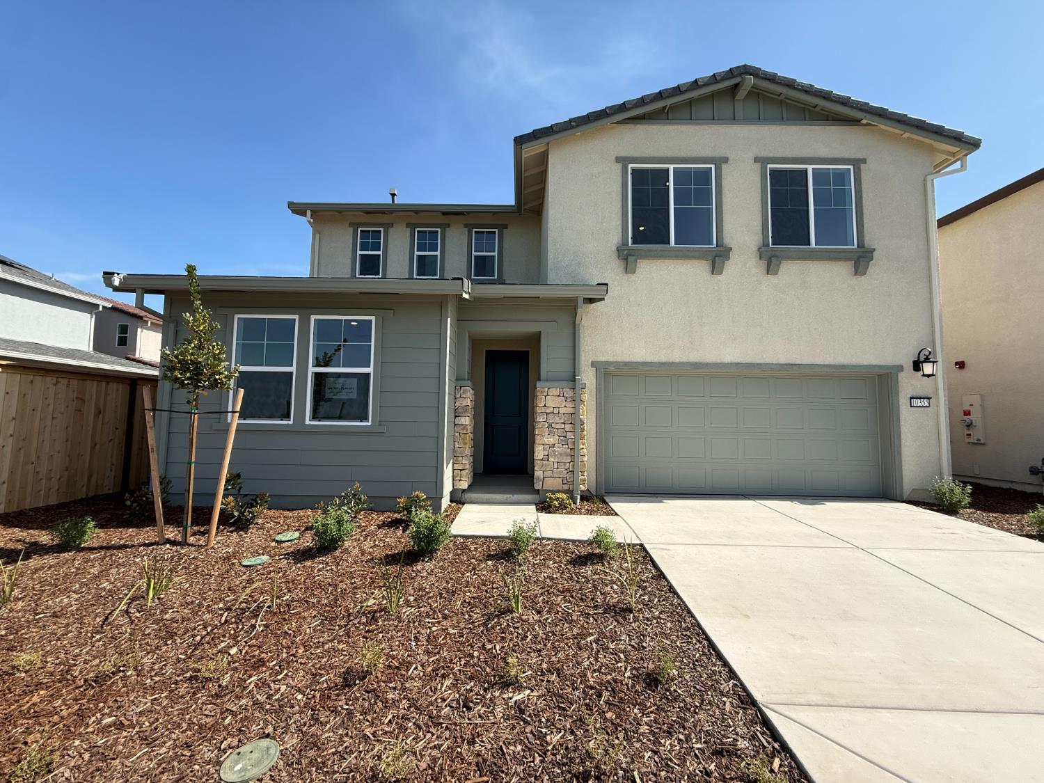 10355 Cadette Way Elk Grove, CA 95757 - Photo 1 of 15 a front view of a house with a yard