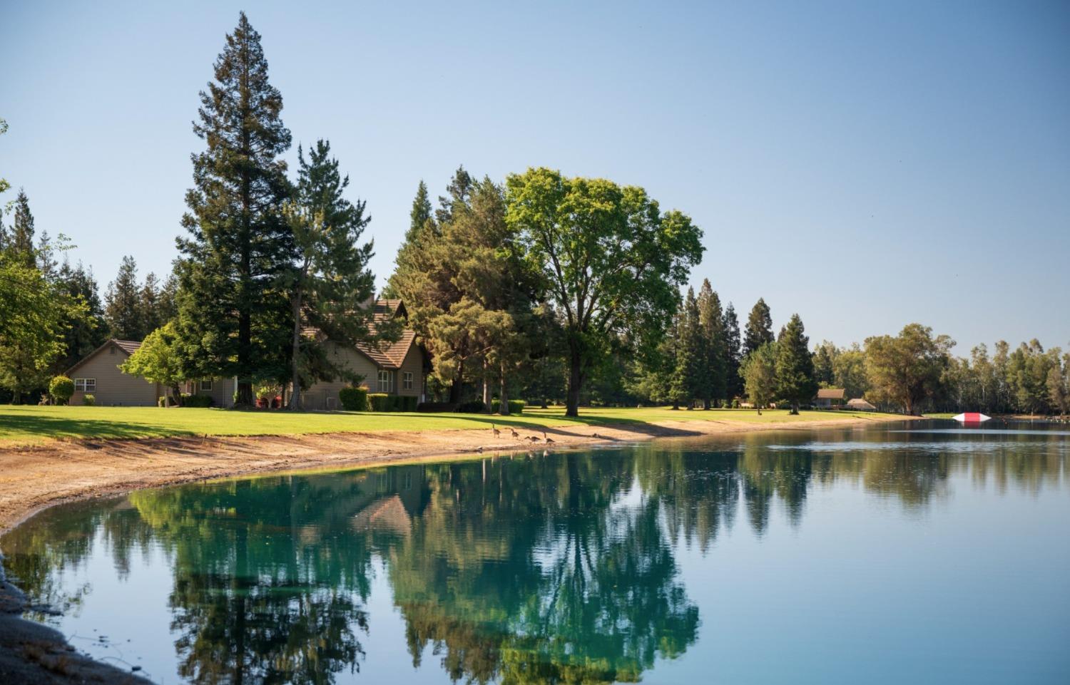 10355 Cadette Way Elk Grove, CA 95757 - Photo 12 of 15 a view of a lake with trees