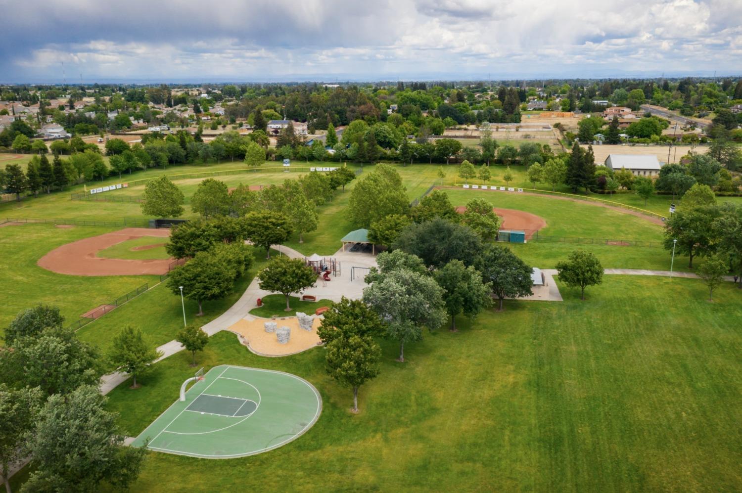 10355 Cadette Way Elk Grove, CA 95757 - Photo 14 of 15 an aerial view of residential houses with outdoor space and lake view