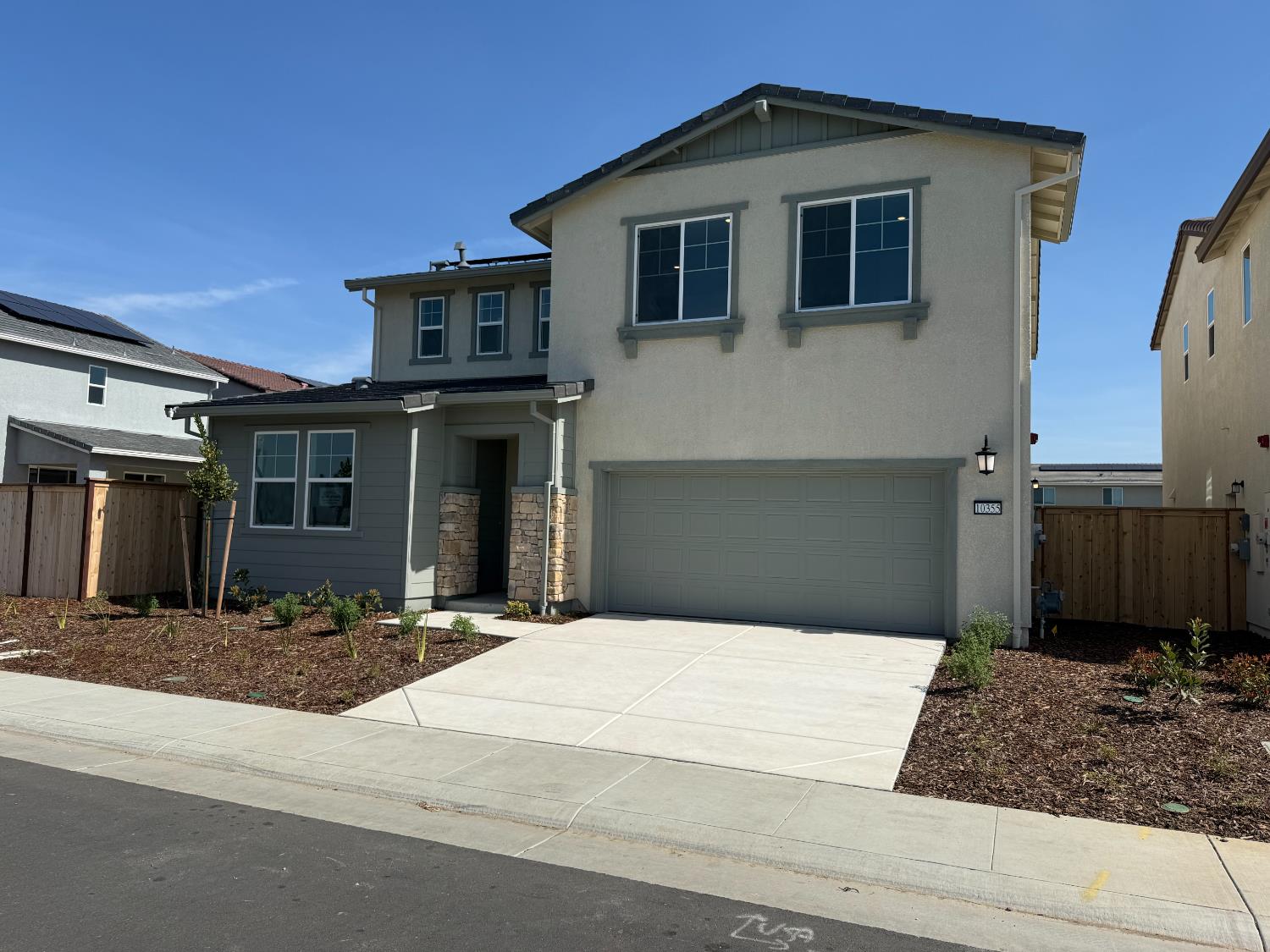 10355 Cadette Way Elk Grove, CA 95757 - Photo 2 of 15 a front view of a house with a yard