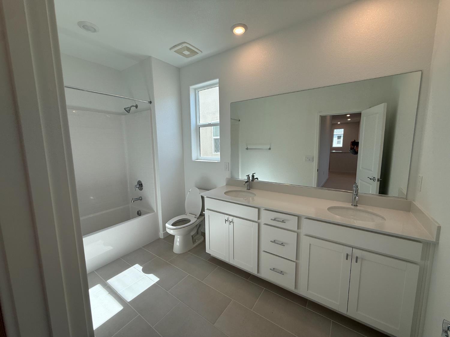 10355 Cadette Way Elk Grove, CA 95757 - Photo 8 of 15 a bathroom with a double vanity sink toilet mirror and bathtub