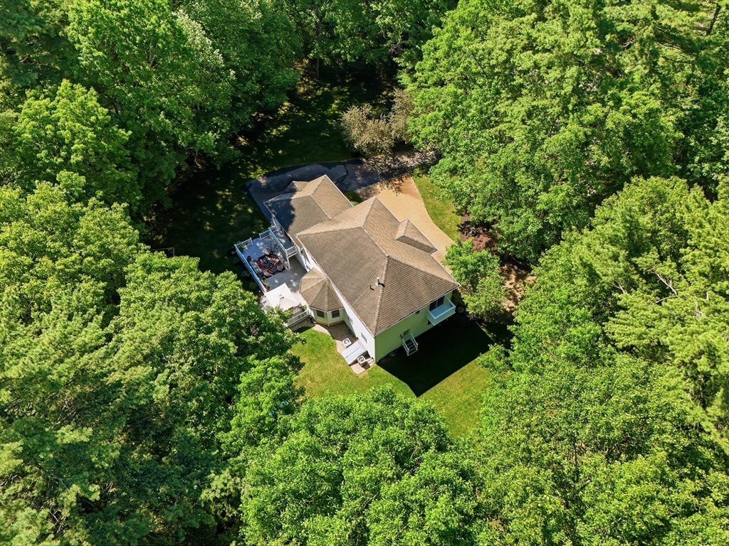 25 Haymeadow Road Boxford, MA 01921 - Photo 41 of 42 an aerial view of a house with a yard and trees