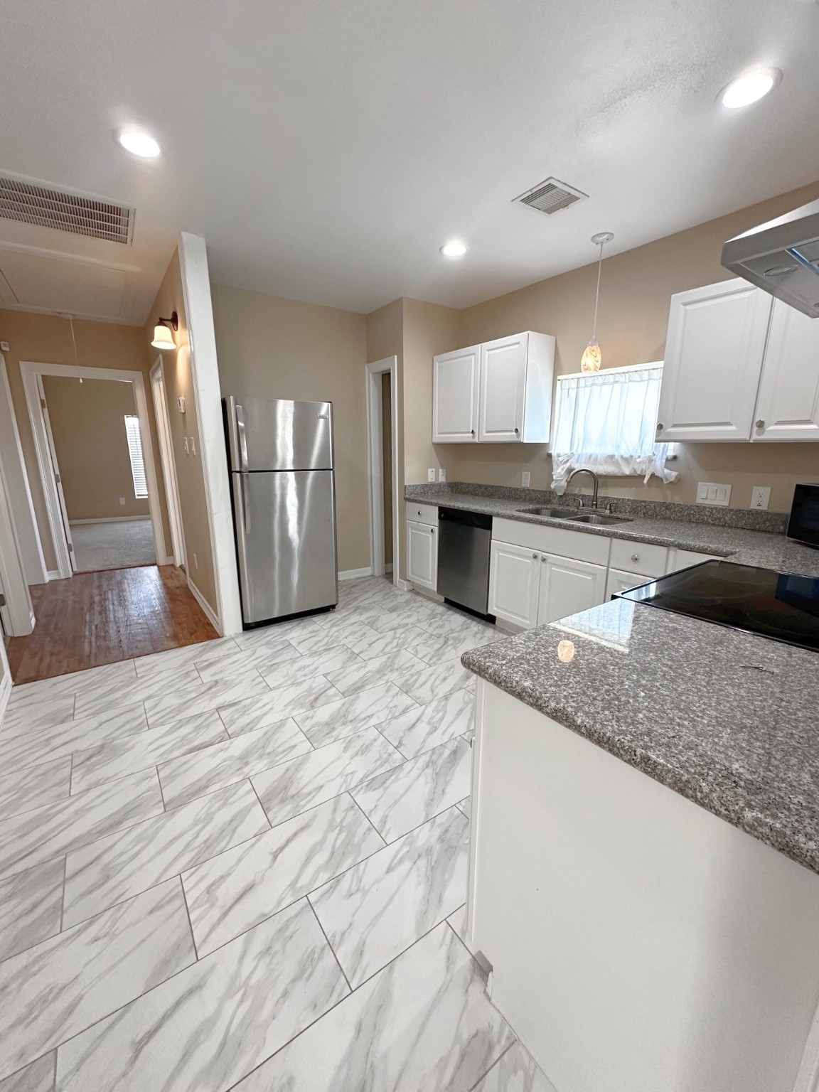 4146 Brinkley Street Houston, TX 77051 - Photo 2 of 9 a large kitchen with stainless steel appliances granite countertop a granite counter tops and a stove