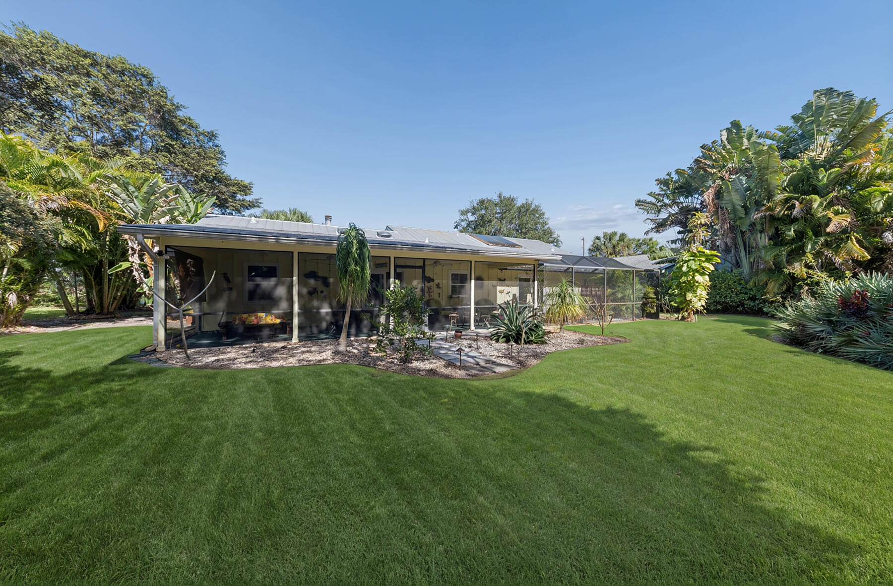 8816 Southeast May Terrace Hobe Sound, FL 33455 - Photo 16 of 27 Exterior Back