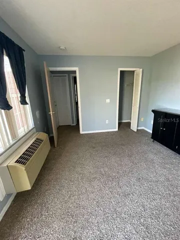 a view of an empty room with a fireplace