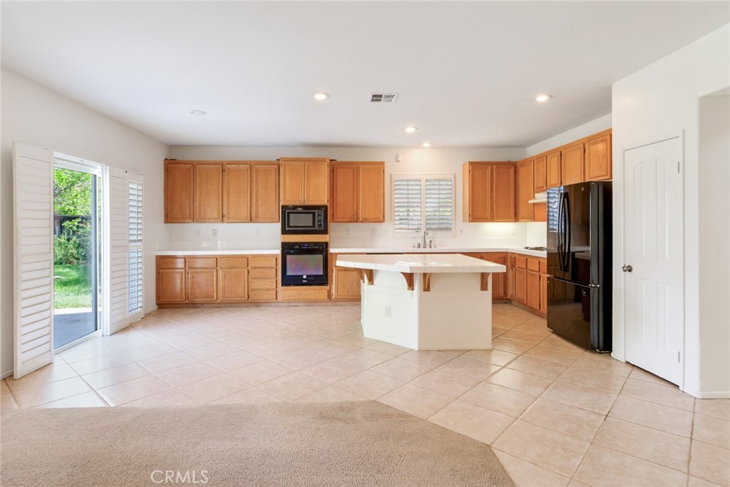 9140 Village Way Riverside, CA 92508 - Photo 12 of 37 Kitchen with sliding door to backyard