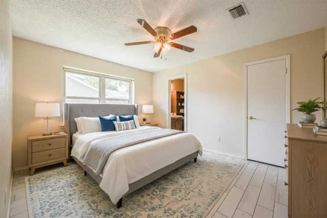 a bedroom with a bed and window