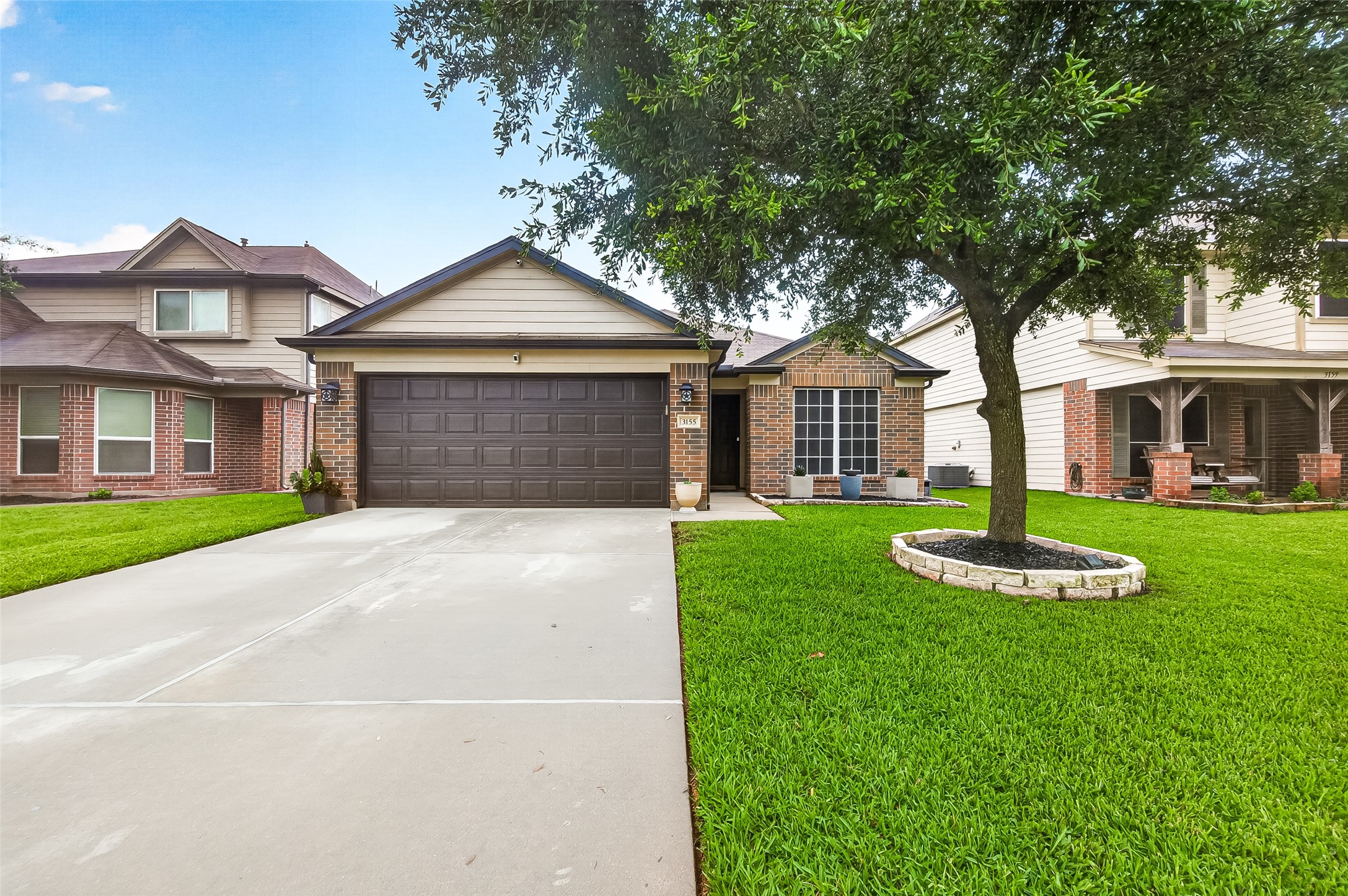 3155 View Valley Trail Katy, TX 77493 - Photo 1 of 50 Stunning curb appeal featuring elegant architectural design, a spacious driveway, and a beautifully manicured lawn that welcomes you home