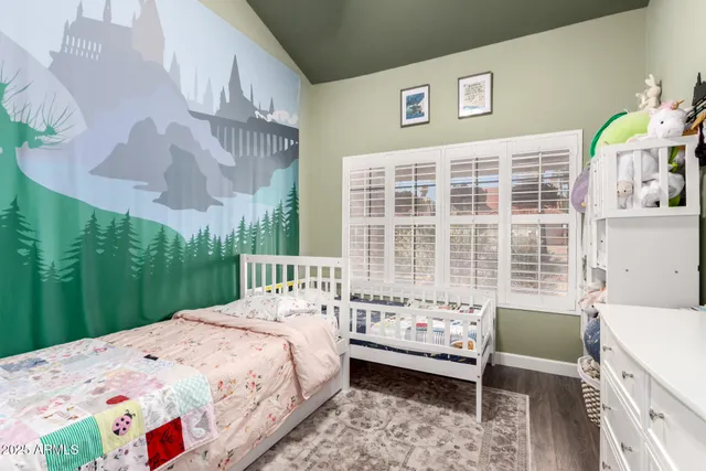 a bedroom with a bed and a view of bathroom