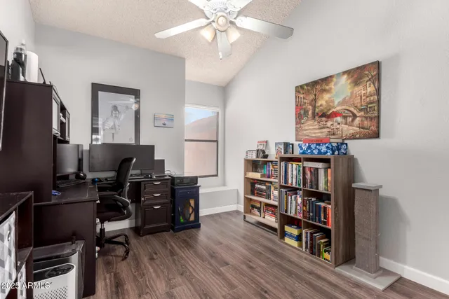 a view of a livingroom with furniture and a flat screen tv