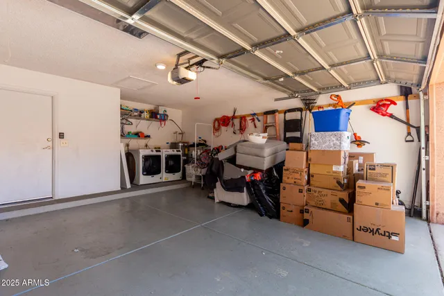 a view of a backyard with plants and outdoor seating
