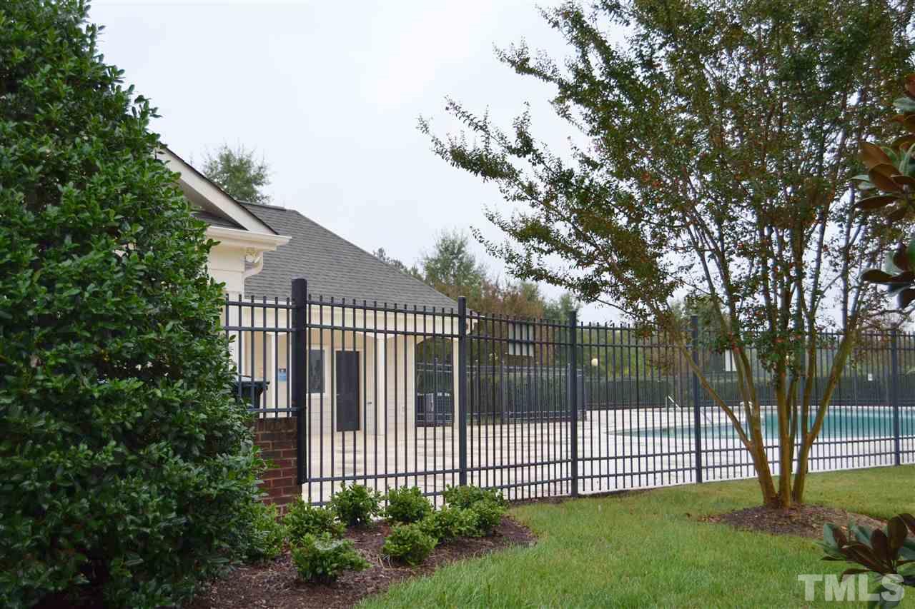 7840 Silverthread Lane Raleigh, NC 27617 - Photo 21 of 21 a view of a house with a small yard and a large tree