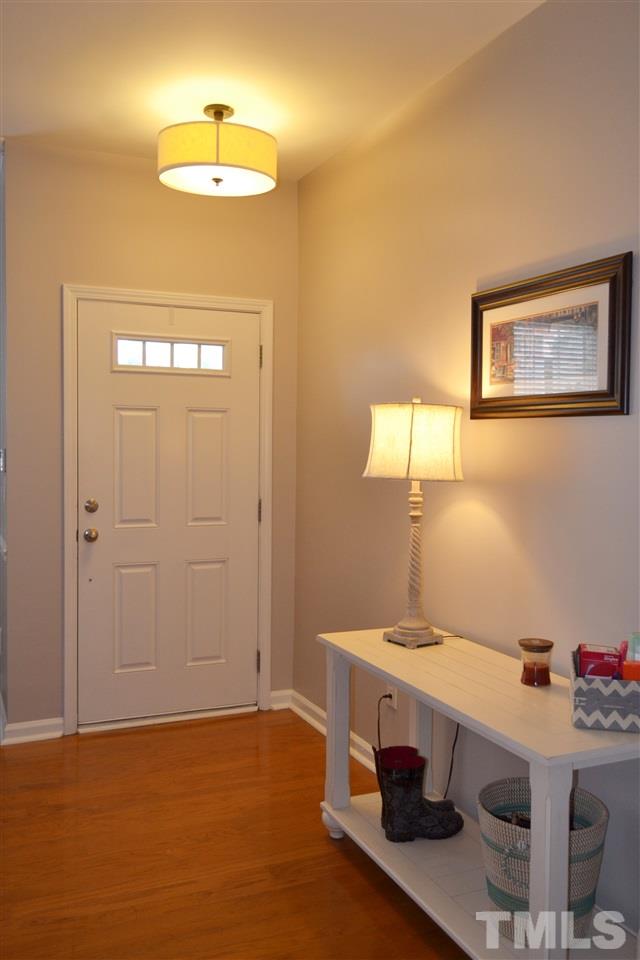 7840 Silverthread Lane Raleigh, NC 27617 - Photo 6 of 21 a view of workspace with a table and chandelier