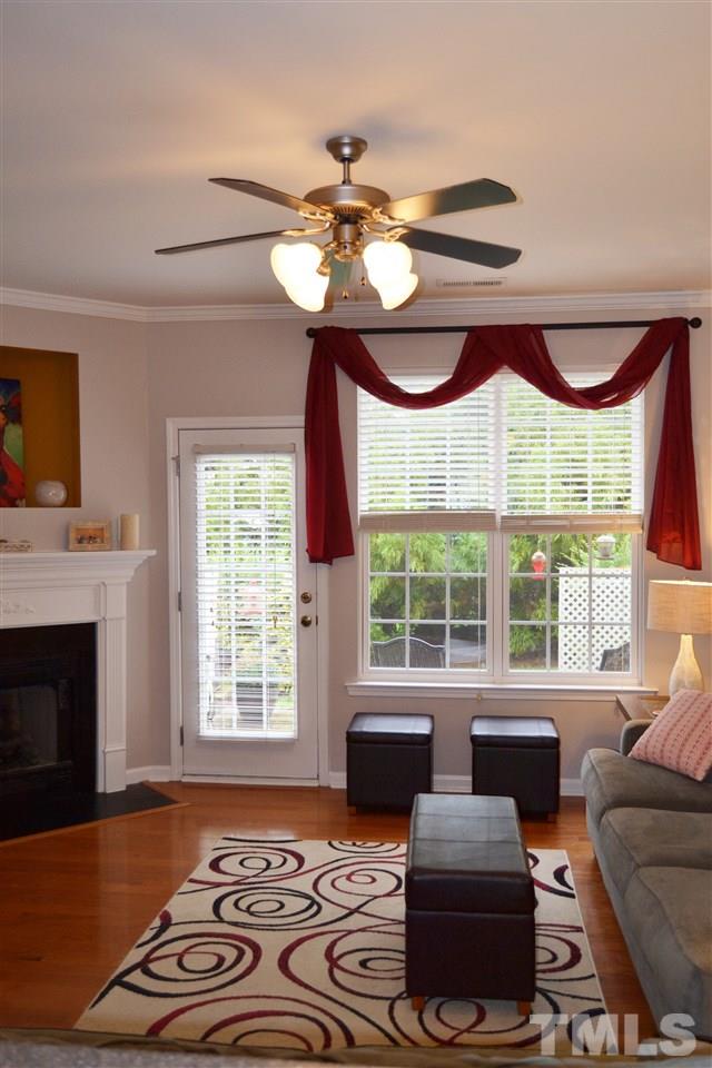 7840 Silverthread Lane Raleigh, NC 27617 - Photo 7 of 21 a bedroom with furniture and a large window