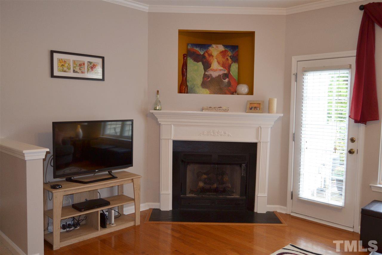 7840 Silverthread Lane Raleigh, NC 27617 - Photo 8 of 21 a living room with furniture and a flat screen tv