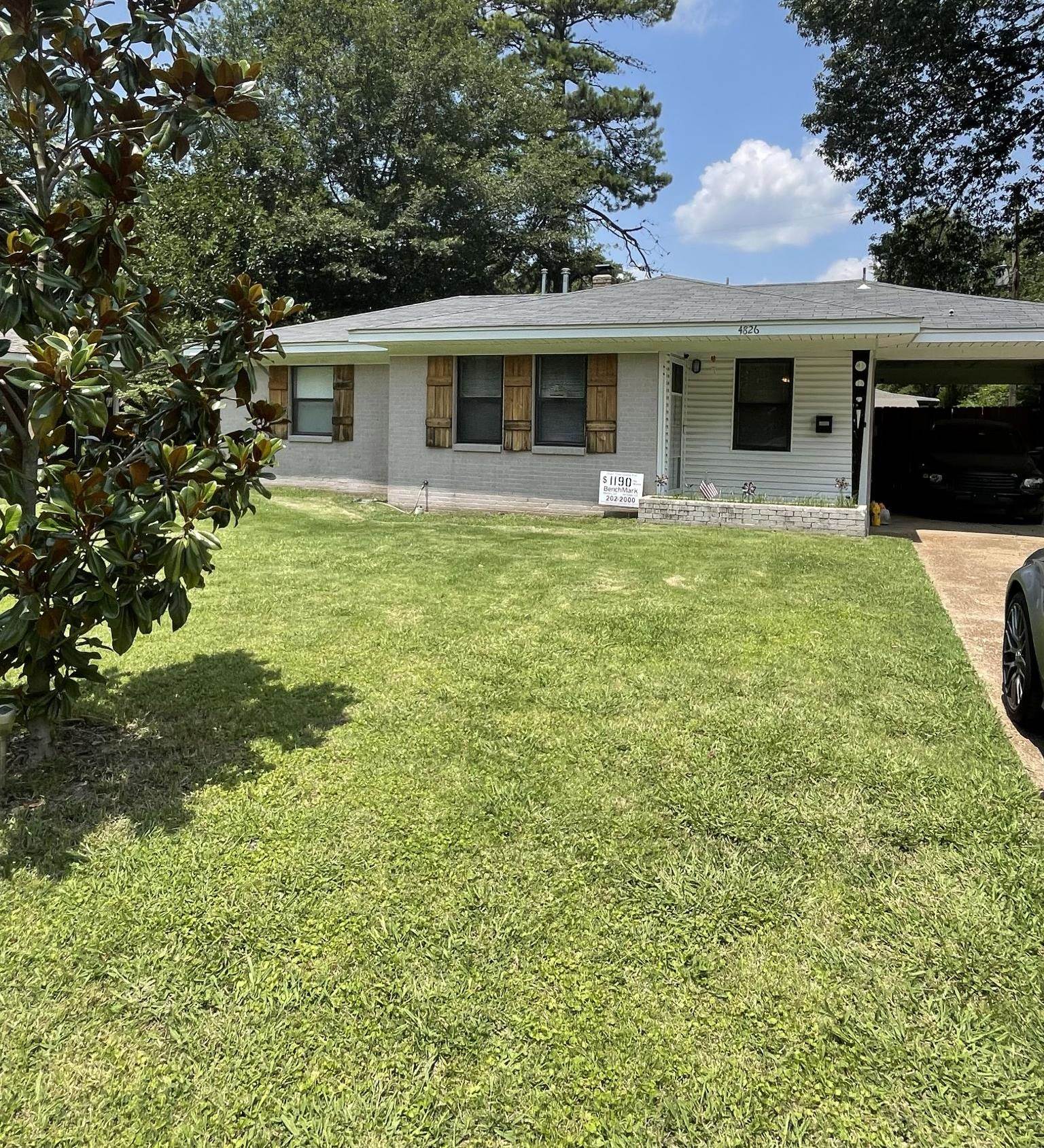 4826 Quince Road Memphis, TN 38117 - Photo 1 of 11 a front view of house with yard