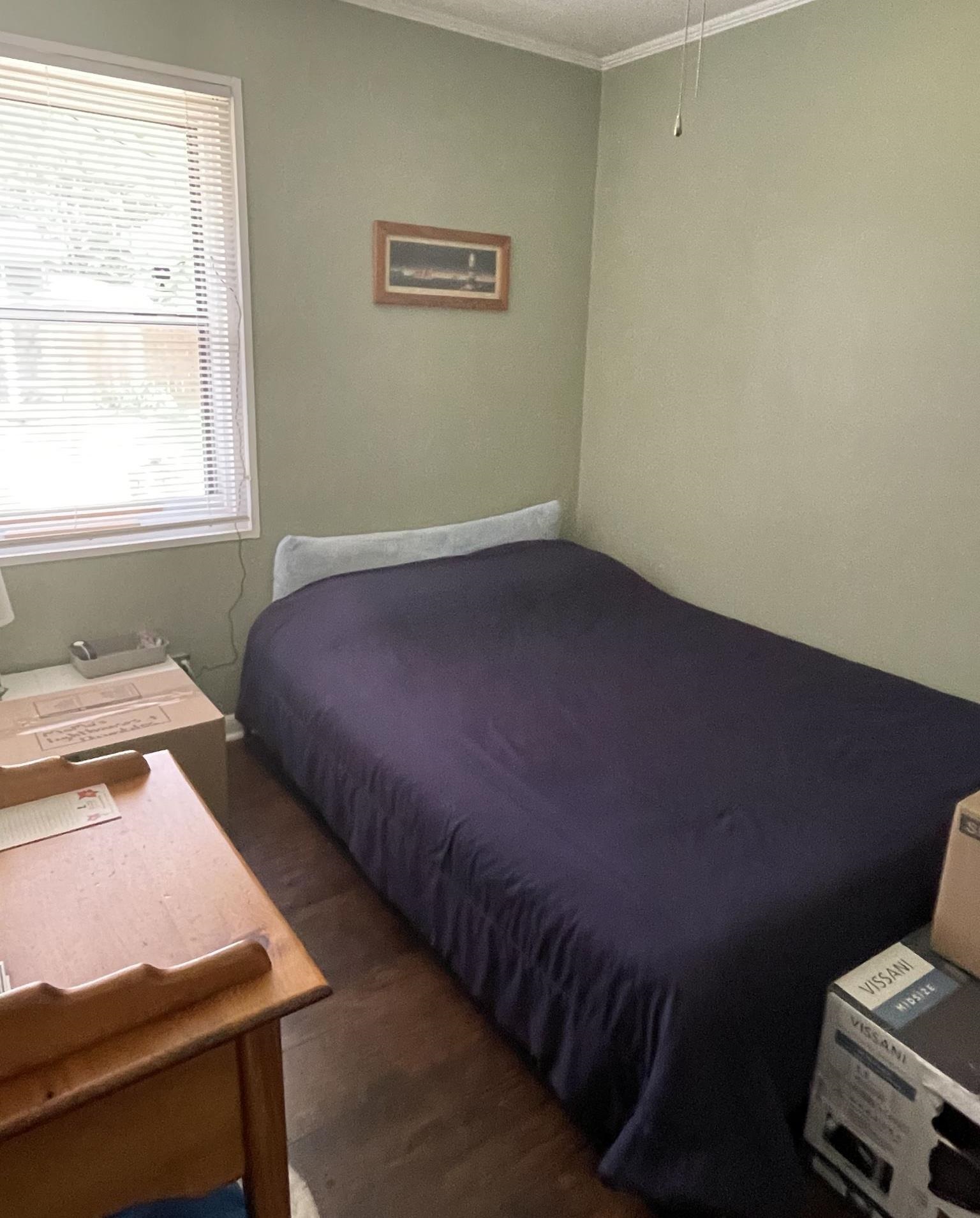 4826 Quince Road Memphis, TN 38117 - Photo 8 of 11 a bedroom with a bed and a window