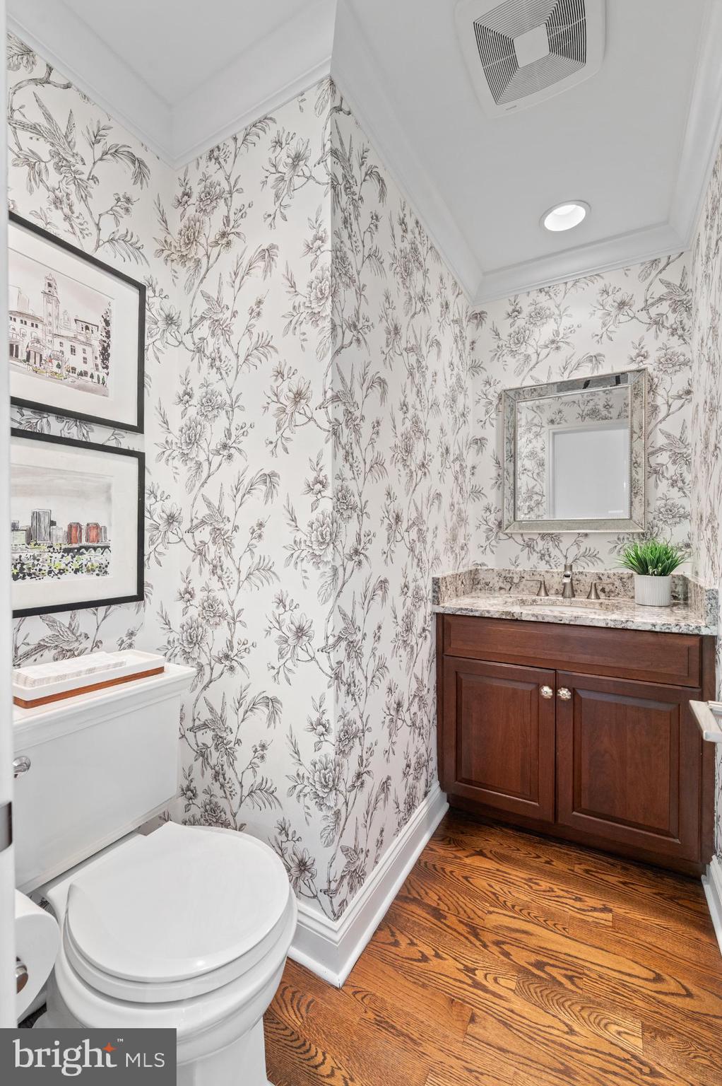 8 Brettagne Devon, PA 19333 - Photo 12 of 38 a bathroom with a granite countertop toilet sink and a mirror