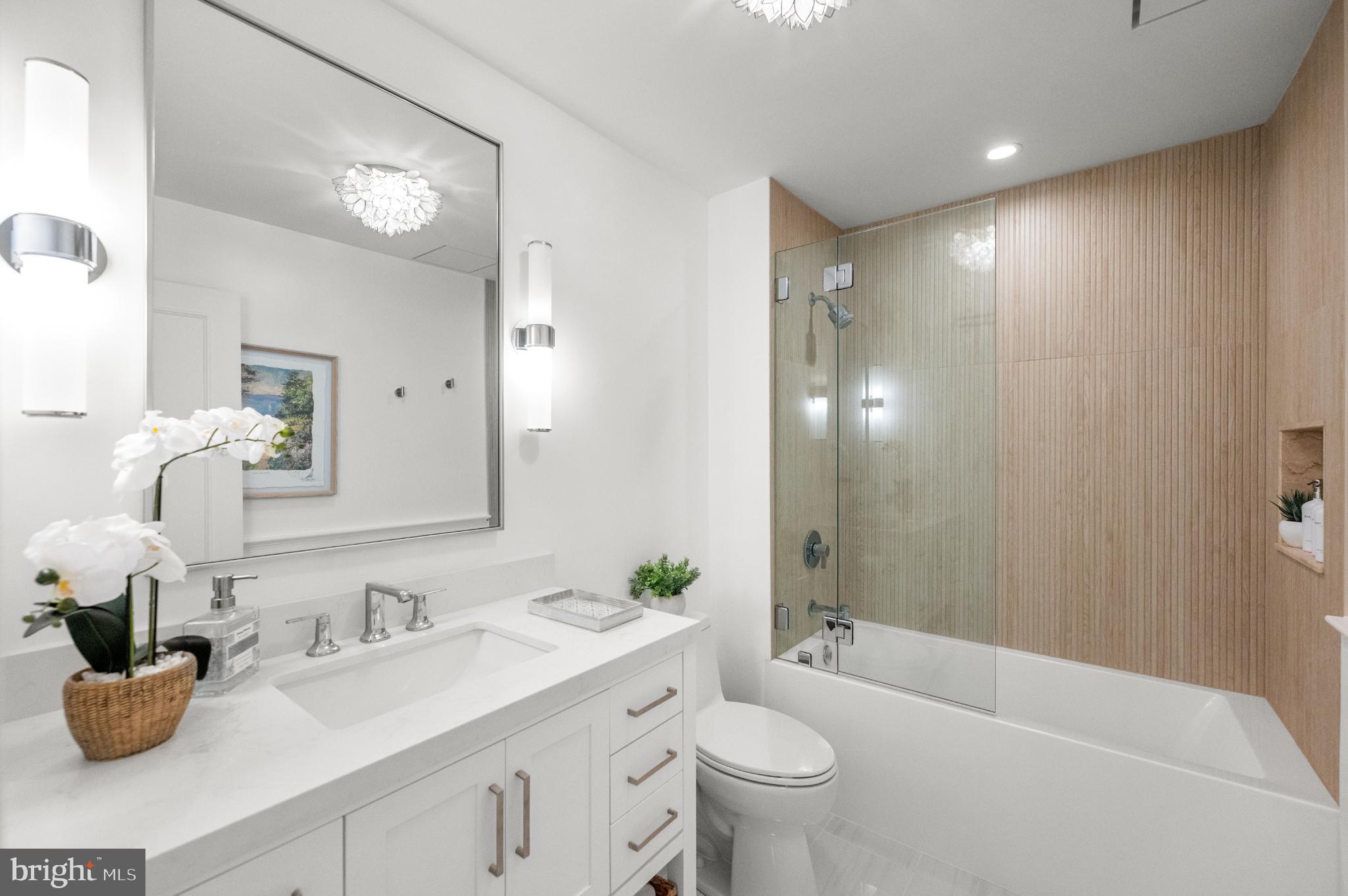 8 Brettagne Devon, PA 19333 - Photo 22 of 38 a bathroom with a granite countertop sink mirror and toilet