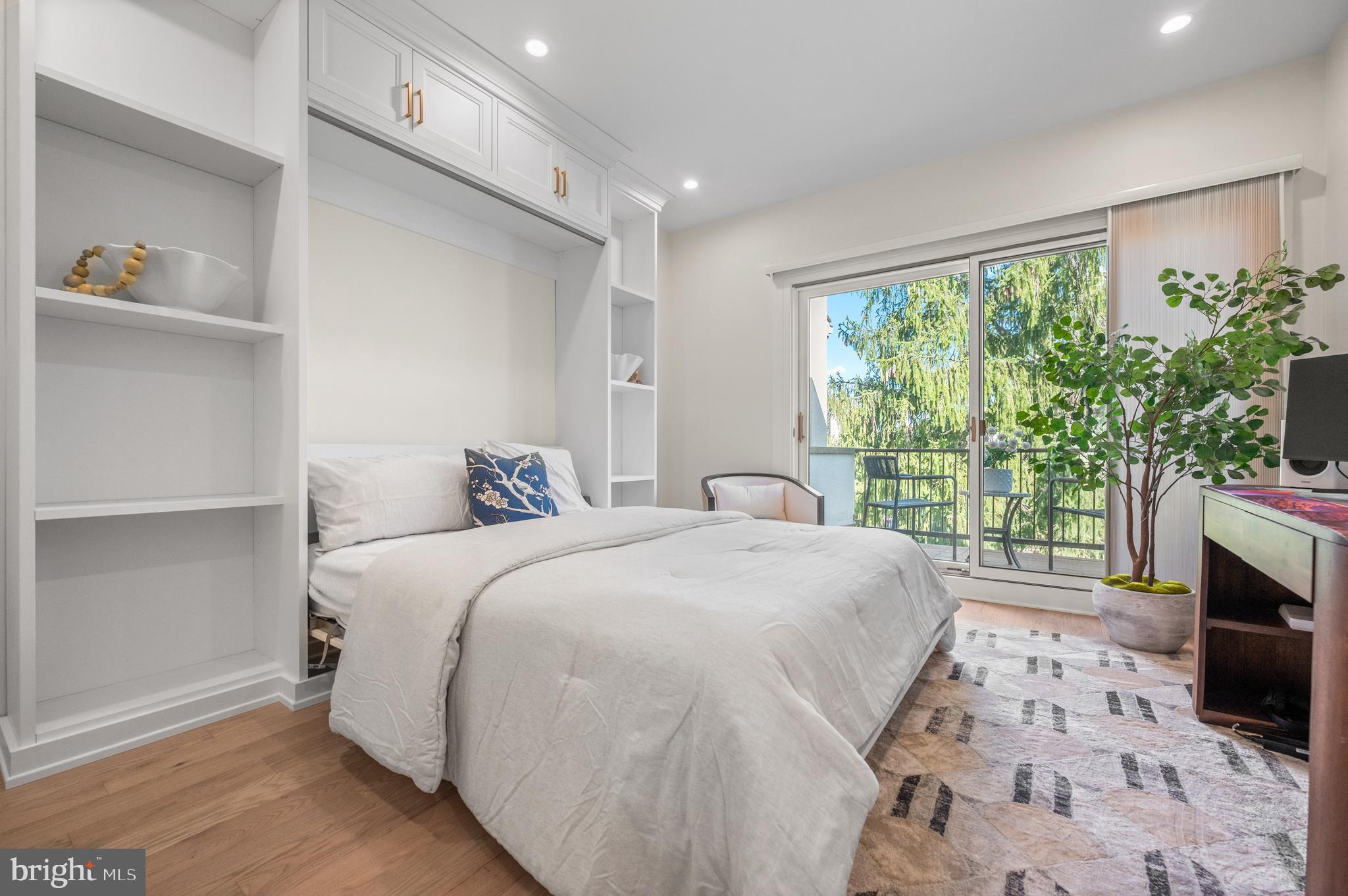 8 Brettagne Devon, PA 19333 - Photo 23 of 38 a spacious bedroom with a bed and a fireplace