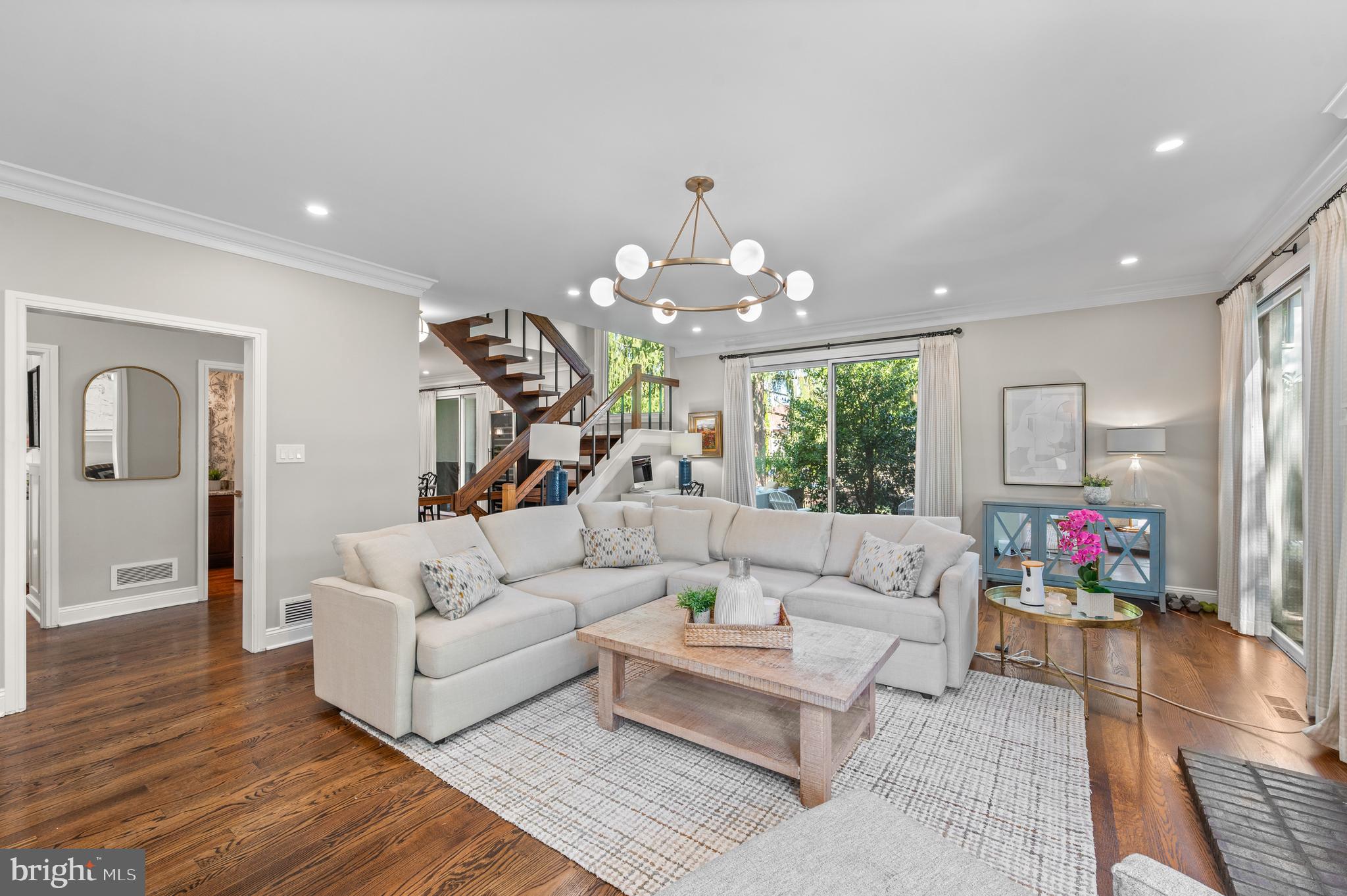 8 Brettagne Devon, PA 19333 - Photo 3 of 38 a living room with furniture and a chandelier