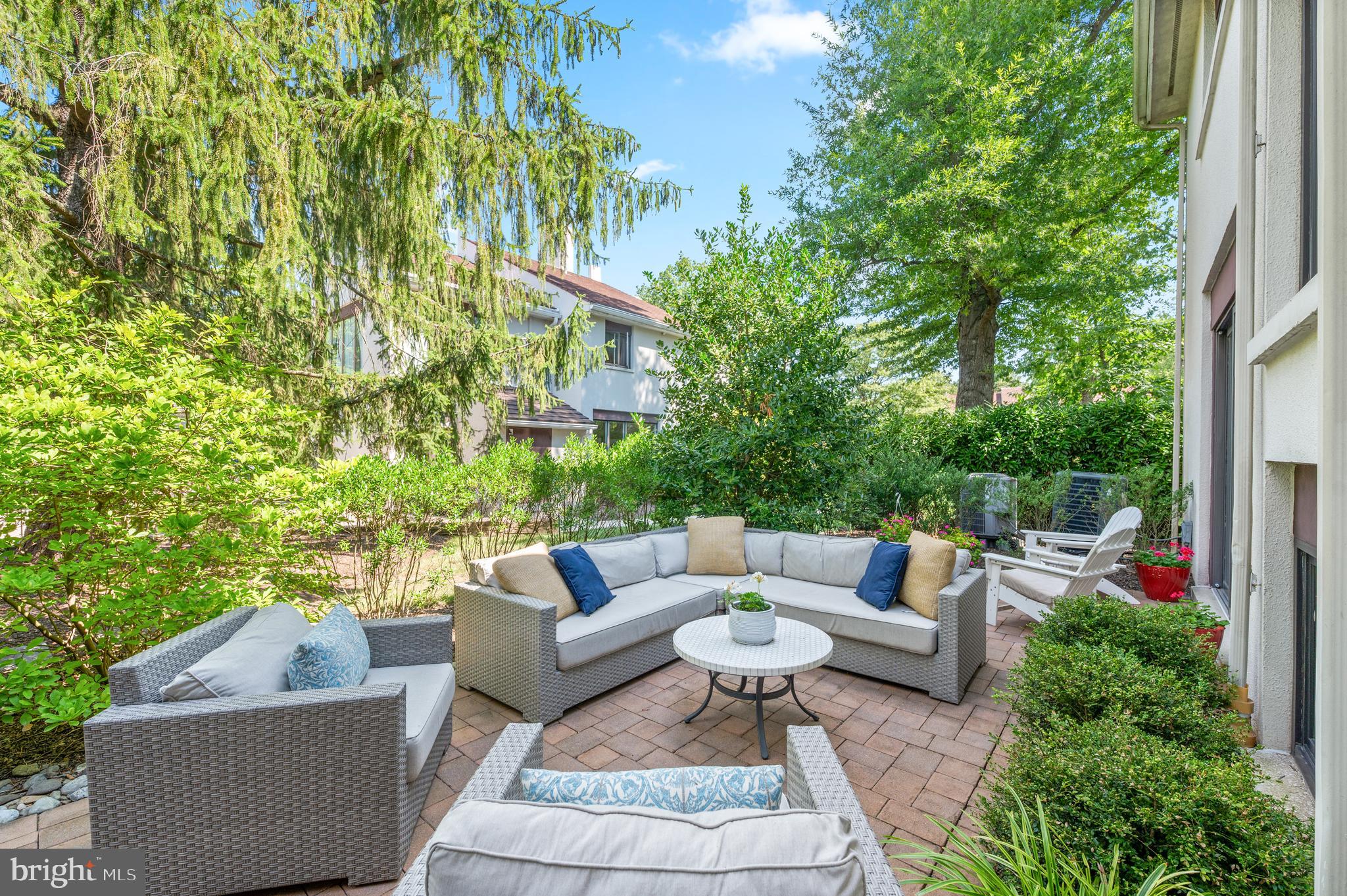 8 Brettagne Devon, PA 19333 - Photo 33 of 38 a view of a patio with couches and a table and chairs with plants