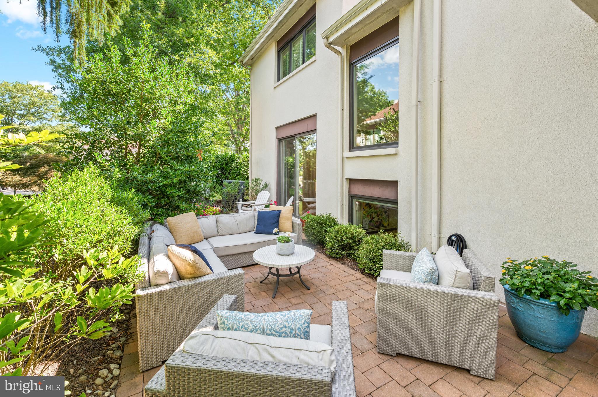 8 Brettagne Devon, PA 19333 - Photo 34 of 38 a view of a patio with couches table and chairs and potted plants