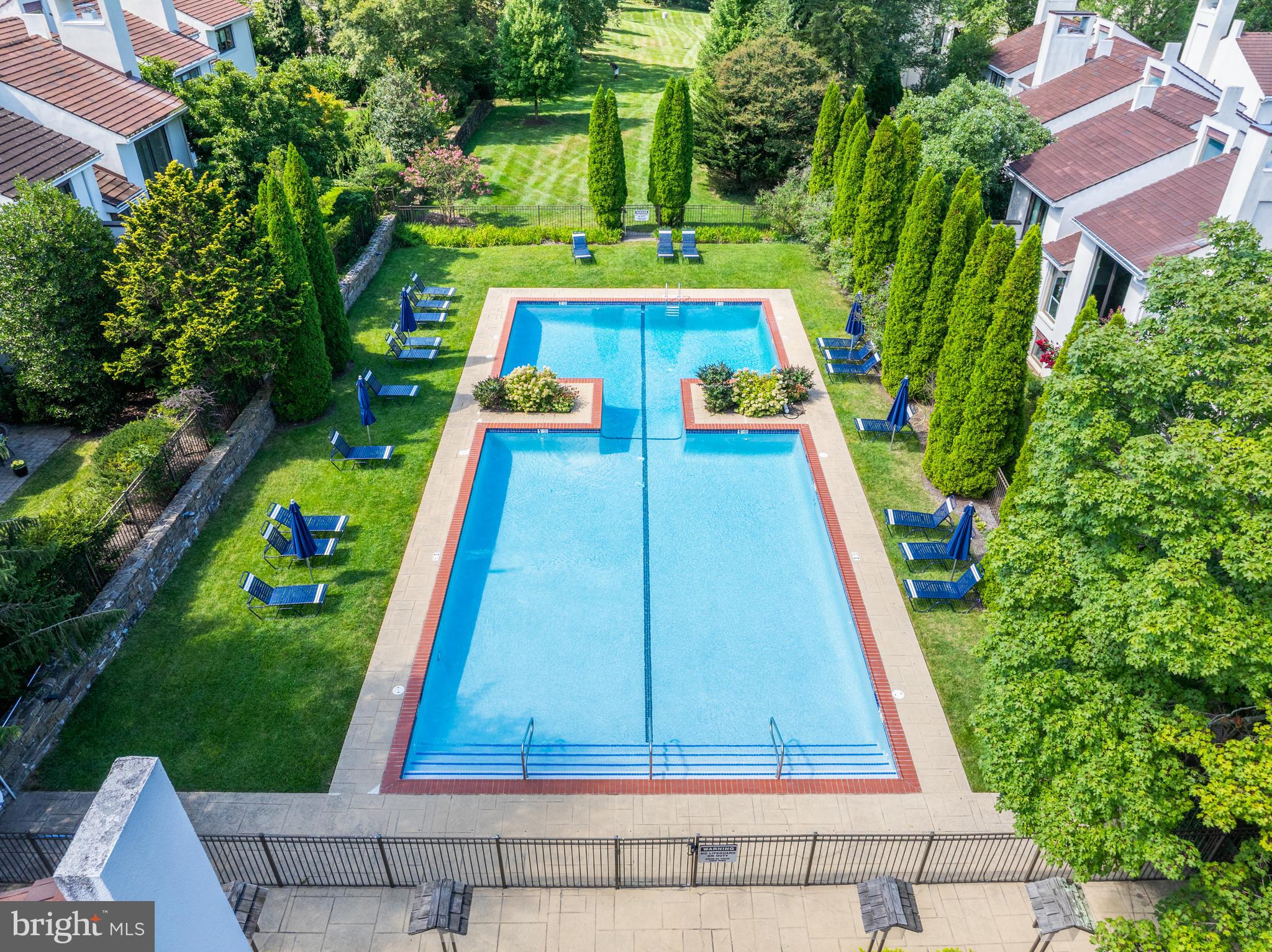 8 Brettagne Devon, PA 19333 - Photo 37 of 38 a view of a backyard with a small pool
