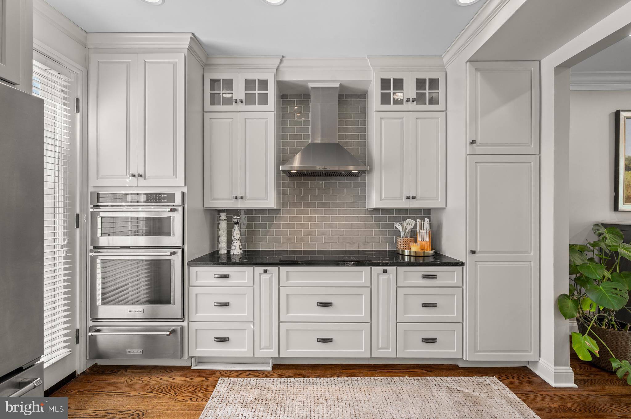 8 Brettagne Devon, PA 19333 - Photo 8 of 38 a kitchen with stainless steel appliances a cabinets and a window