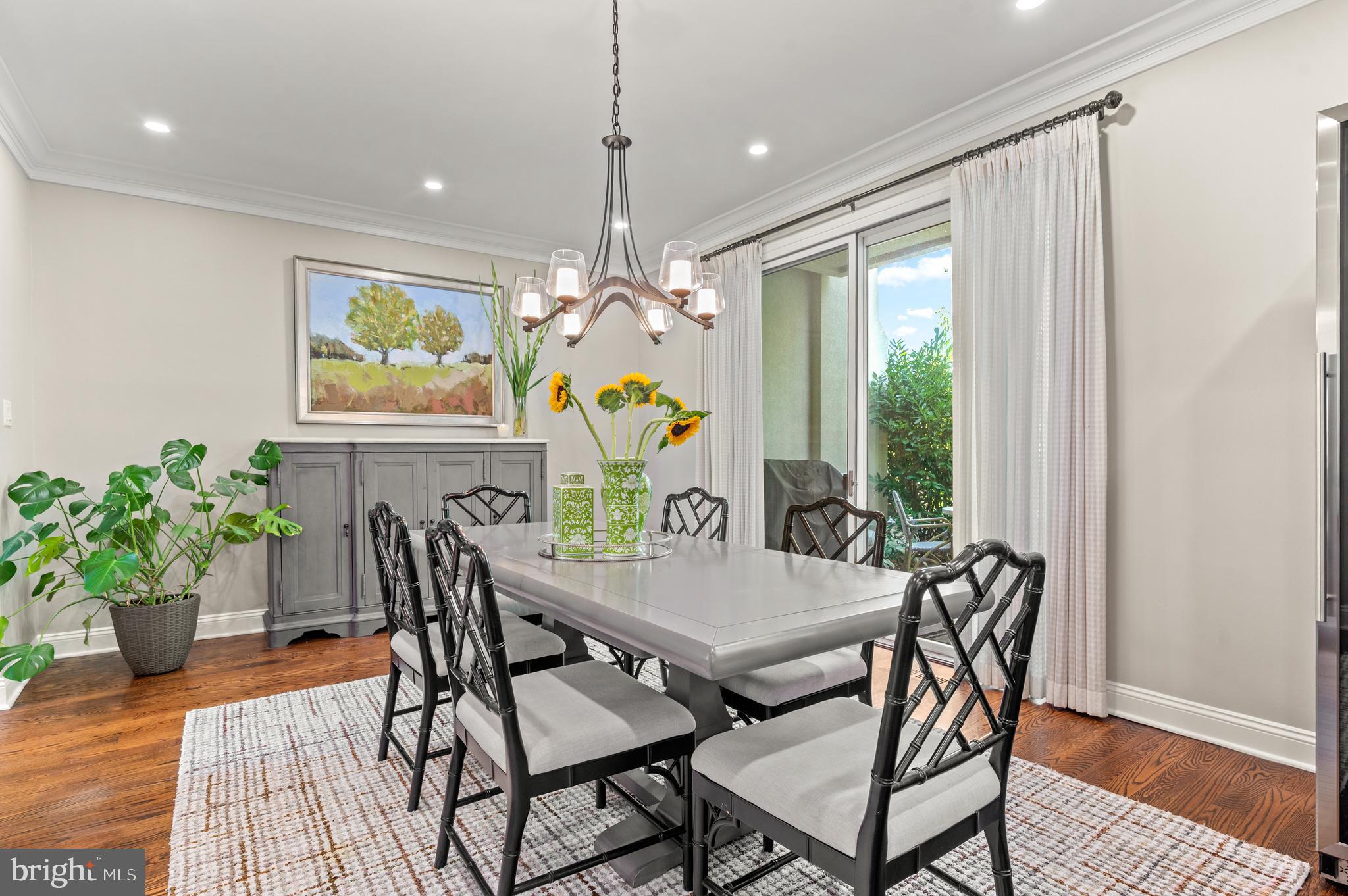 8 Brettagne Devon, PA 19333 - Photo 10 of 38 a view of a dining room with furniture a chandelier and wooden floor