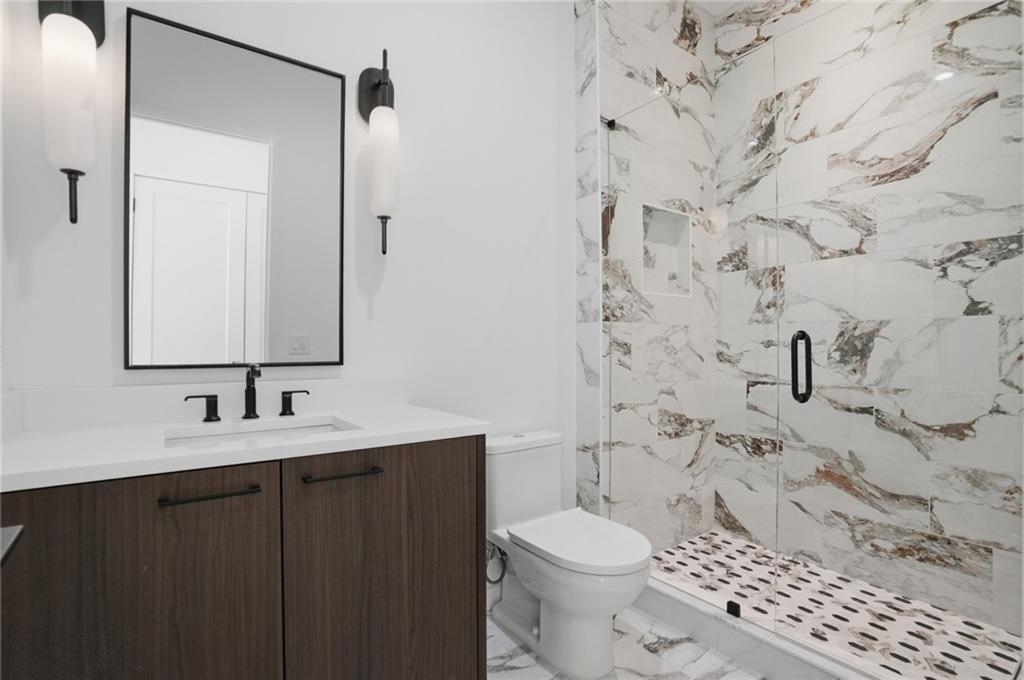 3293 Lenox Place Northeast Atlanta, GA 30324 - Photo 24 of 40 a bathroom with a sink toilet and shower