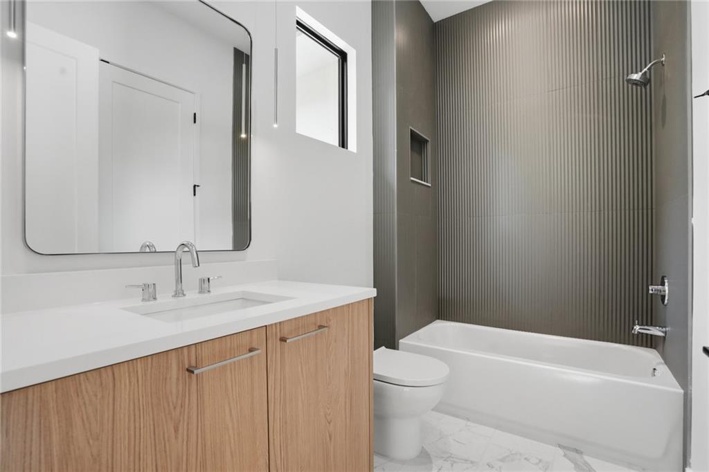 3293 Lenox Place Northeast Atlanta, GA 30324 - Photo 30 of 40 a bathroom with a sink a toilet and shower