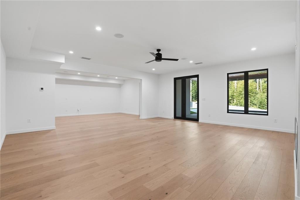 3293 Lenox Place Northeast Atlanta, GA 30324 - Photo 32 of 40 an empty room with wooden floor and windows