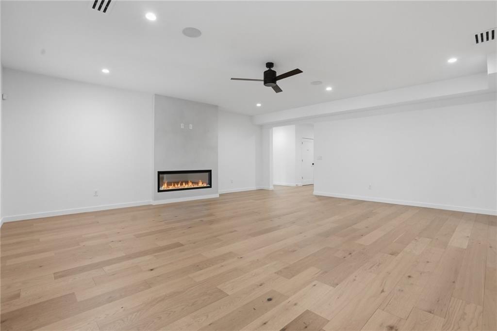 3293 Lenox Place Northeast Atlanta, GA 30324 - Photo 33 of 40 an empty room with wooden floor and windows
