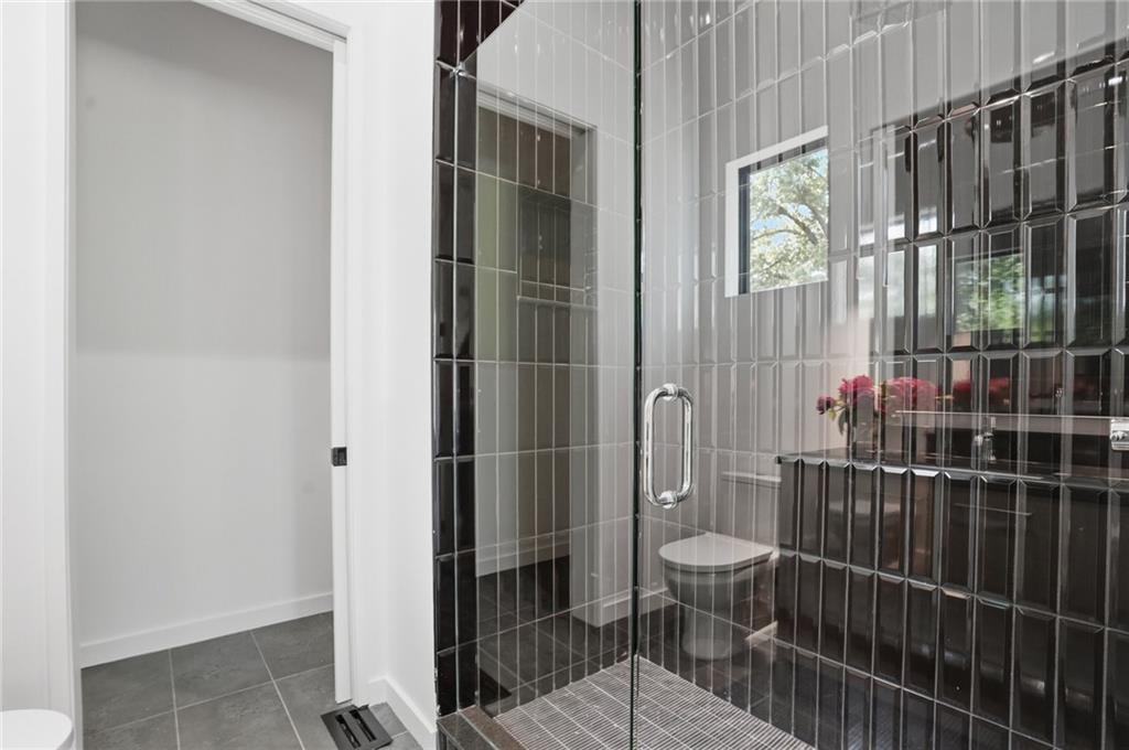 3293 Lenox Place Northeast Atlanta, GA 30324 - Photo 35 of 40 a bathroom with a toilet and a shower