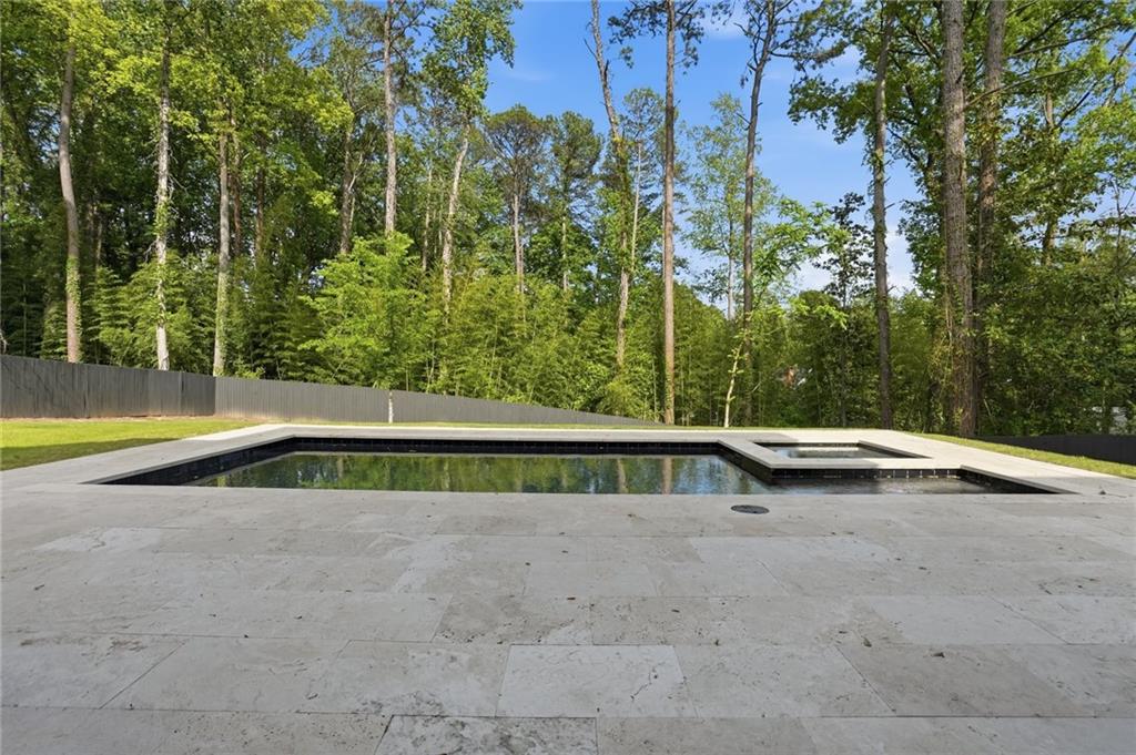 3293 Lenox Place Northeast Atlanta, GA 30324 - Photo 39 of 40 a view of yard with swimming pool and trees in the background
