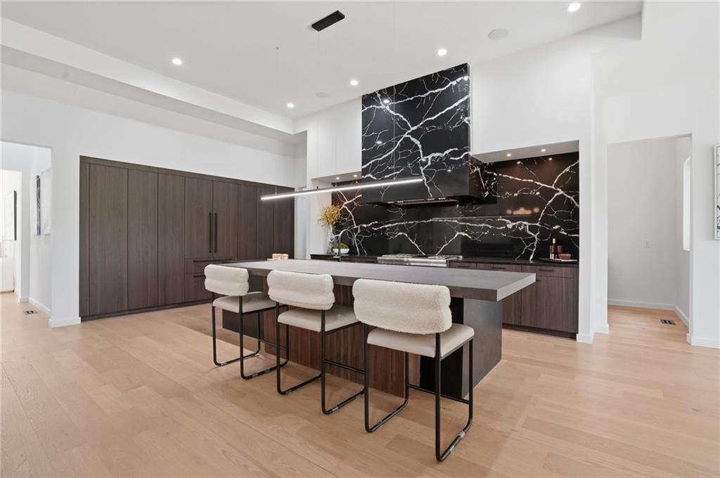 3293 Lenox Place Northeast Atlanta, GA 30324 - Photo 6 of 40 a kitchen with a table and chairs in it
