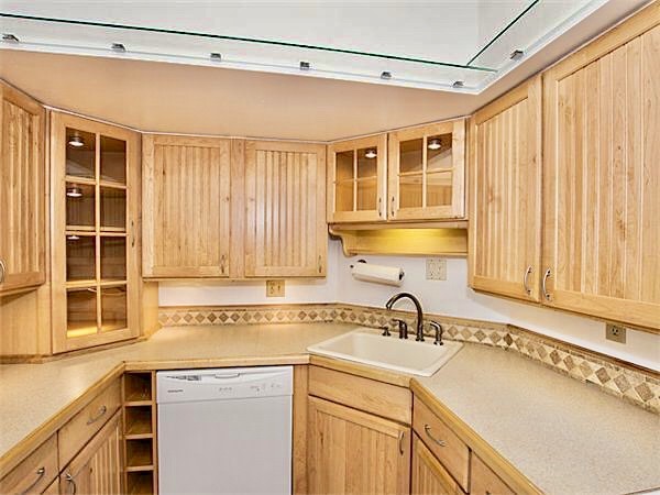 125 Pleasant Street, Unit 309 Brookline, MA 02446 - Photo 2 of 9 a view of a kitchen with a sink and cabinets