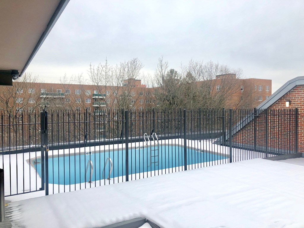 125 Pleasant Street, Unit 309 Brookline, MA 02446 - Photo 8 of 9 a view of a balcony with a city view