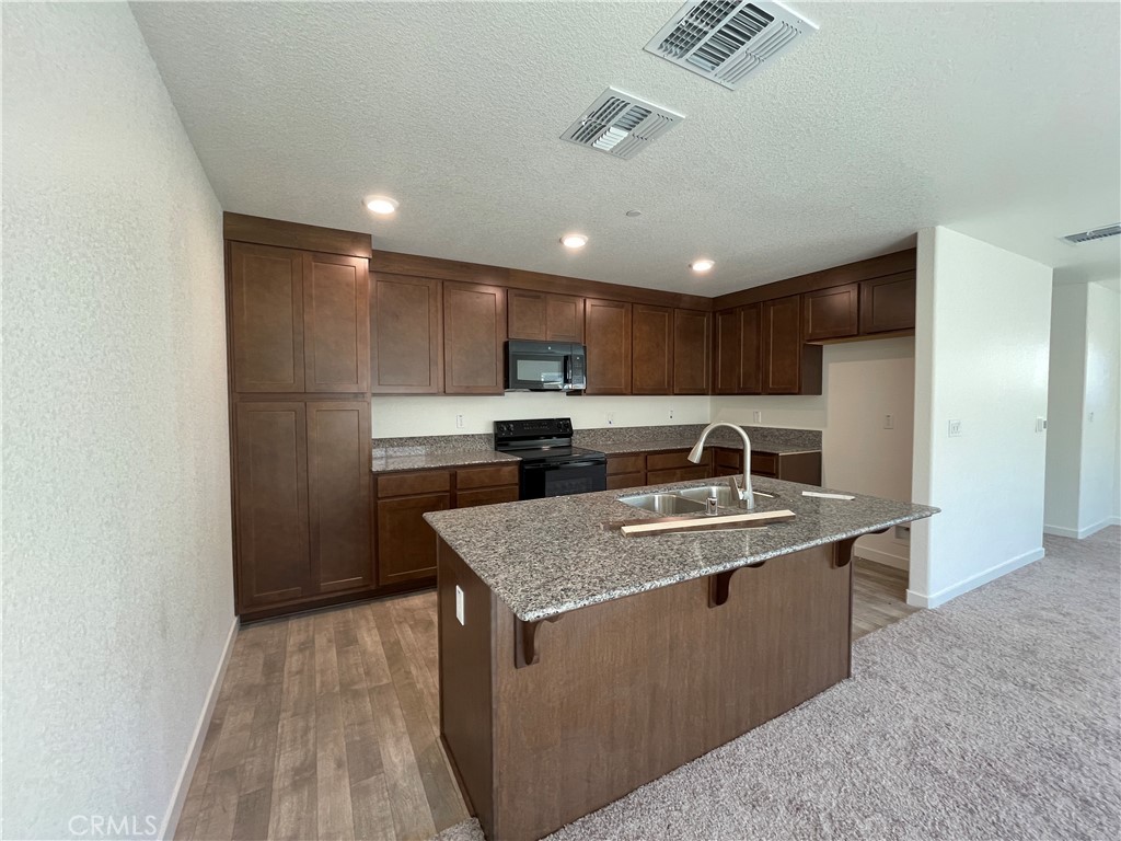 744 Stone Ridge Avenue Merced, CA 95341 - Photo 3 of 6 Representative photo of similar completed home. Actual finishes and materials will vary.
