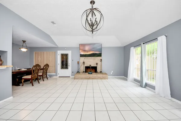 a view of livingroom with furniture fan and window