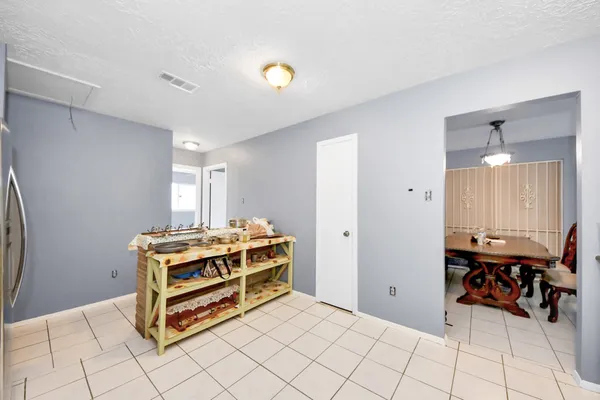 a room with a table and chairs