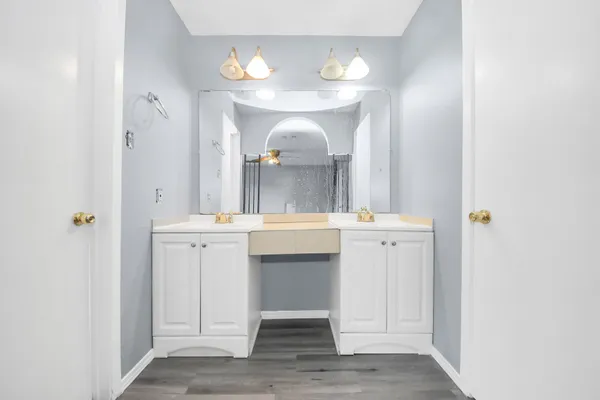 a bathroom with a sink and a mirror