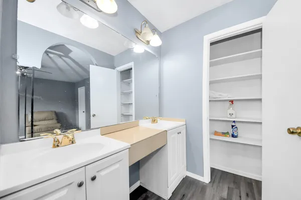 a room with a sink and a mirror